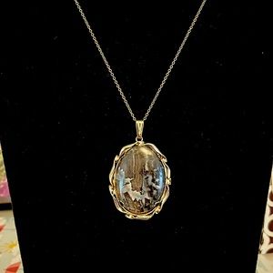 Polished natural stone brown pendant in goldtone setting, goldtone chain